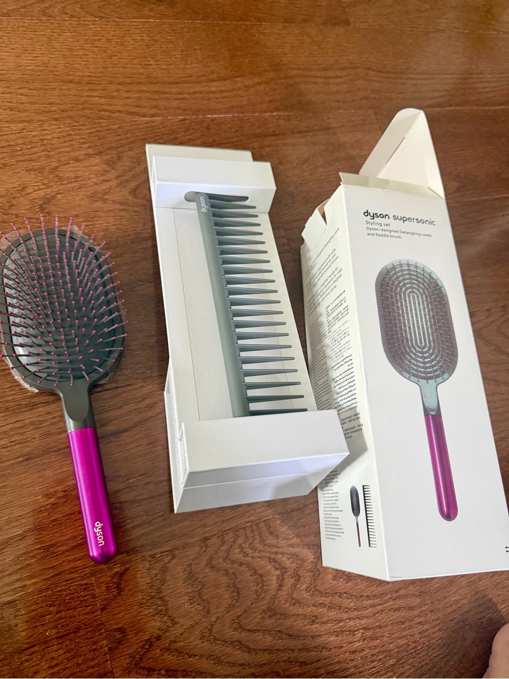 Dyson pink paddle brush with grey cushion